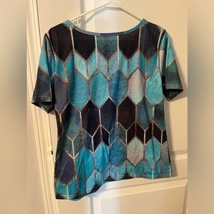 Polyester/cotton, nice design and comfy top